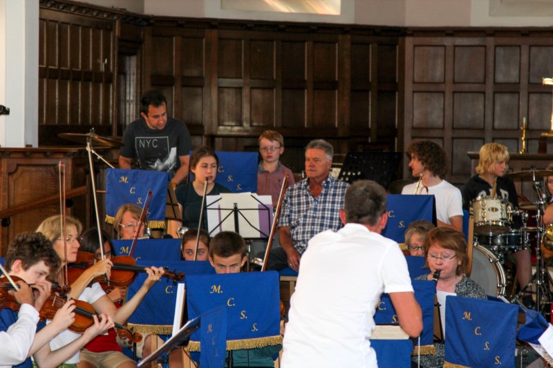 Orchestra practicing as a group