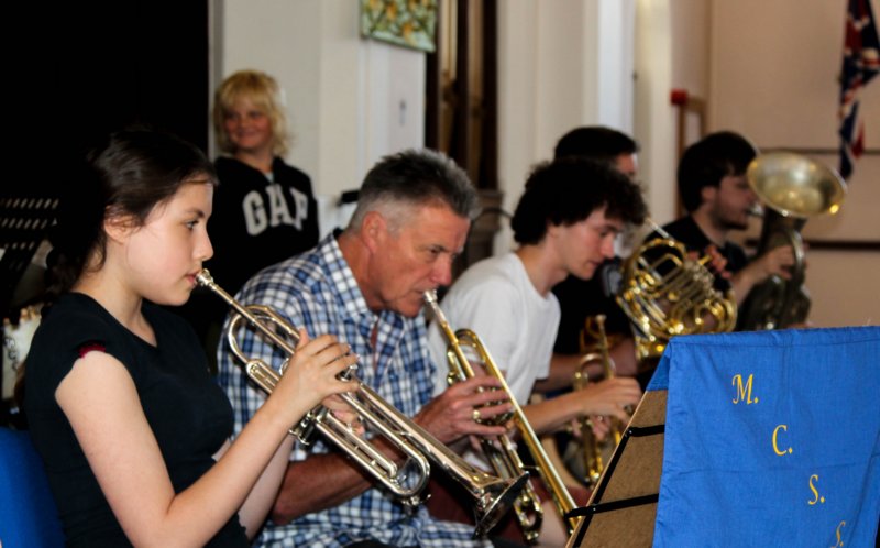 Brass section practicing as a group